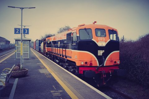 Three quarter shot of the the Irish Rail XPO Logistics intermodal freight train from Ballina to Belview Port, Waterford, standing at the platform awaiting another train to clear a single track section