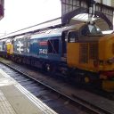 Two class 37 locomotives stand in Norwich station