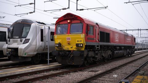 DB Cargo UK Class 66 diesel standing in front of a GTR passenger EMU