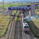 Russian diesel locomotive 2TE10M-2766 with freight train from Russia to China