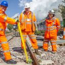 Track workers in orange suits at work near Aberdeen