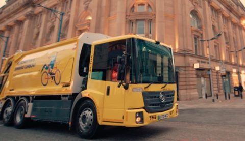 Yellow Biffa electric refuse track on the street in central London