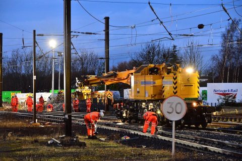 Orange suited engineers at work outside York station