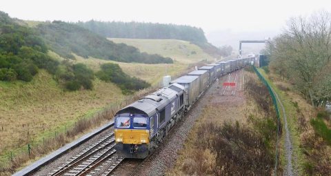 Container train departs the Highland Spring bottling plant in the Stirlingshire countryside