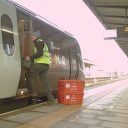 InterCity RailFreight operative loading supplies onto an EMR train