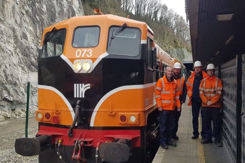 Irish locomotive and train workers on the platform at Waterford station in Ireland