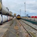 Looking down an Industrial siding towards a GBRf train at Aggregate Industries Purfleet in Essex