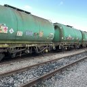 Long shot of line of tank wagons painted green and standing in a siding at Gascoigne Wood