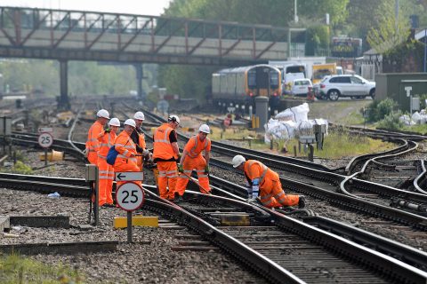 Track workers on the line in their orange hive suits