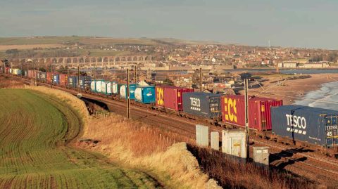 Mixed intermodal train approaches Royal Border Bridge on the East Coast Main Line