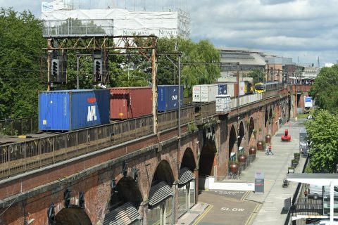 Freight train and passenger train at Manchester Oxford Road