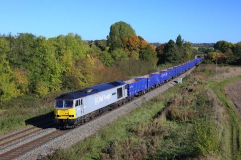 A DCRail aggregates train hauling materials for HS2 in the countryside - seen from a high vantage point