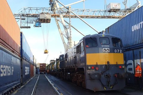 Between two canyons of containers, two intermodal trains are being prepared at Waterford's Belview Terminal in Ireland